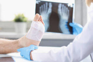 podiatrist looking at a injured foot