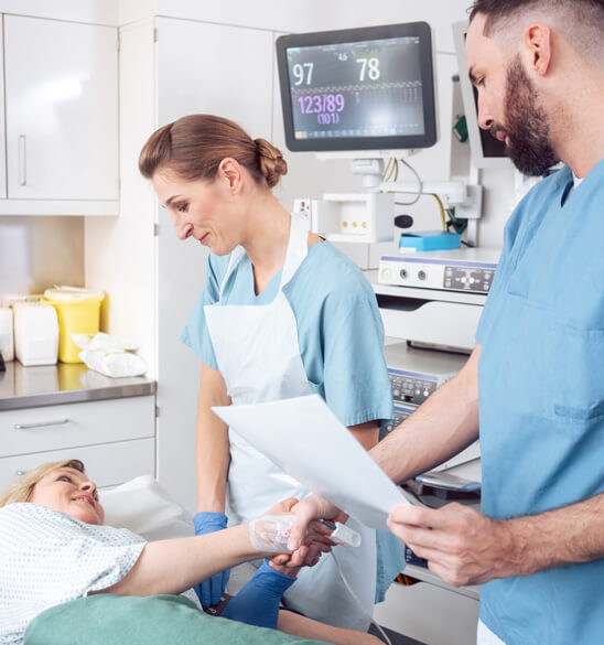 physicians next to patient in medical bed