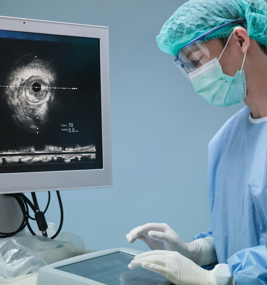 Interventional cardiologist looking at ultrasound