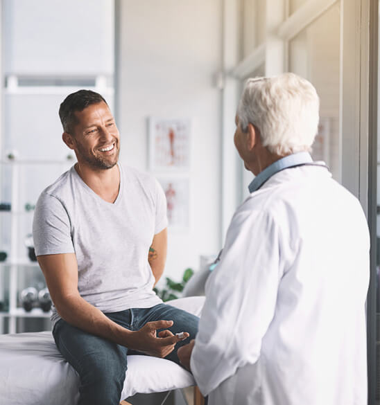  physician talking to a patient 