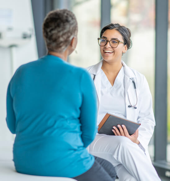 female physician talking to a patient 