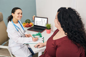 doctor talking to patient about losing weight