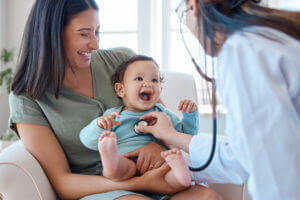 physician checking baby's health