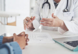 primary care doctor talking to patient