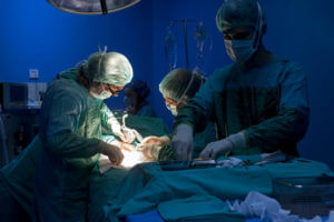 surgeons operating gynecological surgery