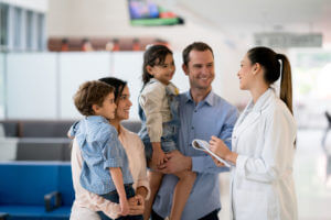 Family Doctor consulting a family for preventive Healthcare screening