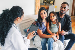 Young family getting medical consultation from family doctor